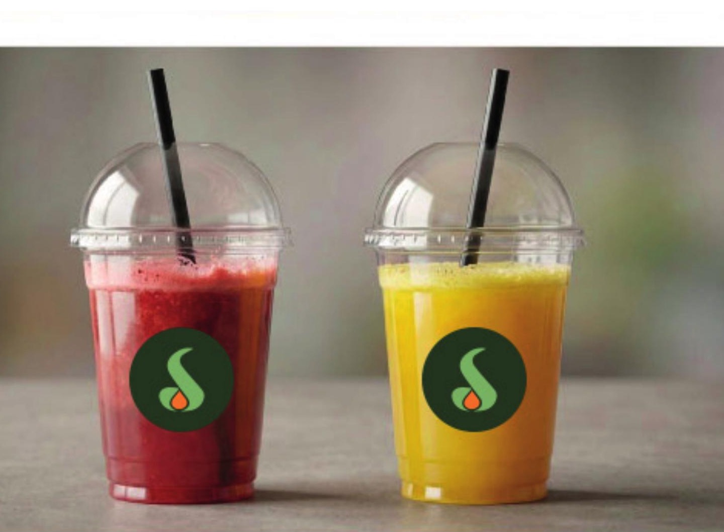 Two Sipora cups — a berry juice and a tropical juice